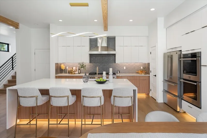 Kitchen island with under-cabinet lighting and beams