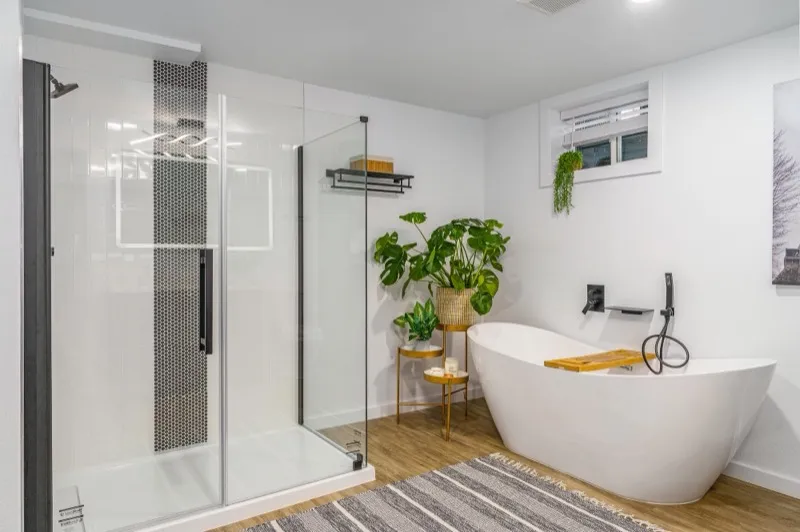 Bathroom with glass shower and patterned tile