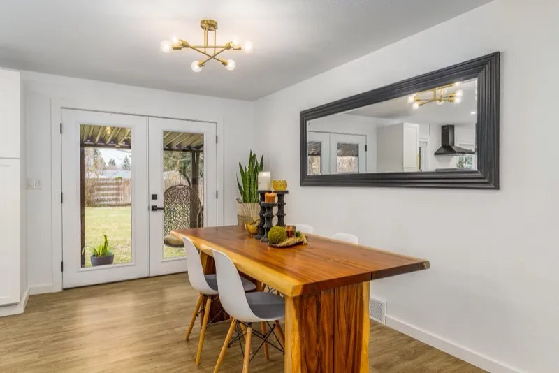 Dining room with live-edge table and statement mirror